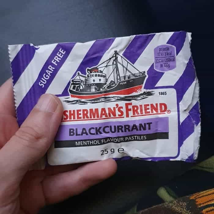 fisherman's friend pastilles, but the first two letters of its name covered up by my thumb so it says sherman's friend