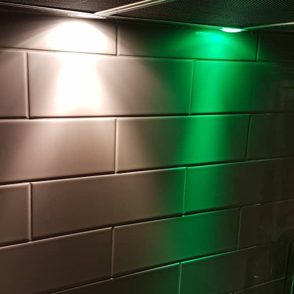 two range hood lights, one white, one green